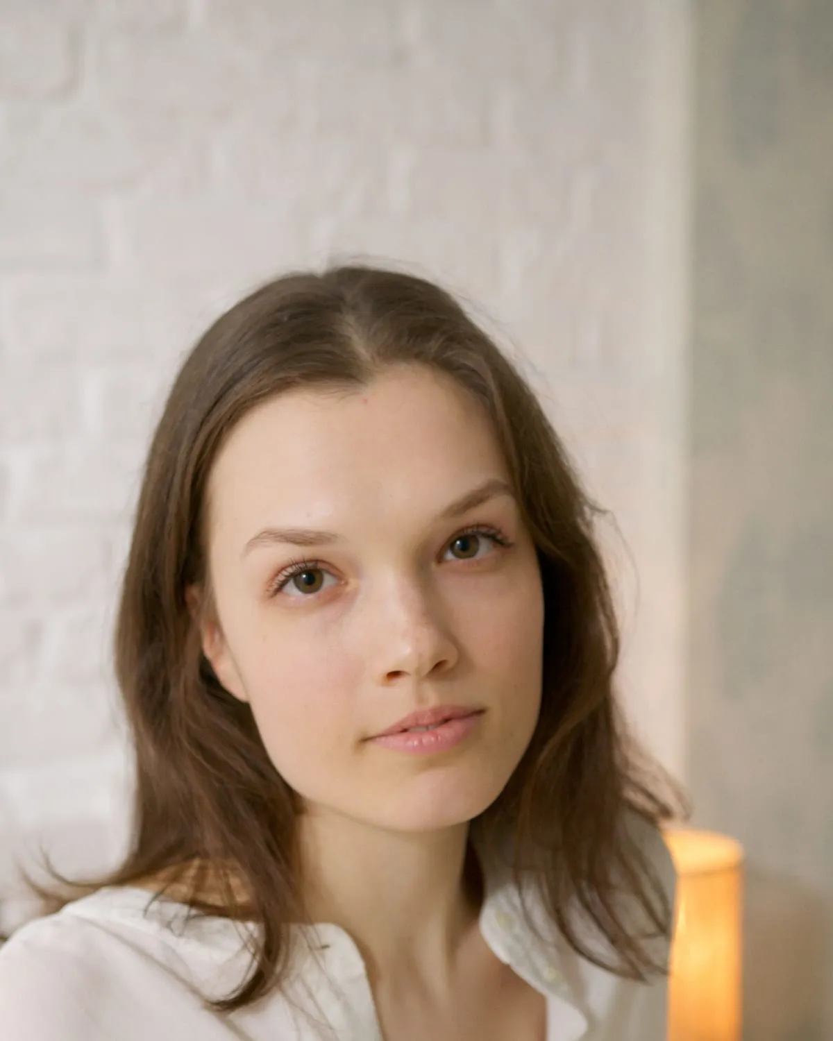 Woman with fresh, natural skin and a barely-there no-makeup makeup look